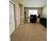 Office space with desk, computer, shelves and carpeted floor at 19246 E Idaho Pl # 102, Aurora, CO 80017