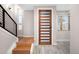 Bright entryway with hardwood floors and modern staircase at 4455 Tennyson St, Denver, CO 80212