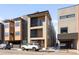 Modern three-story townhome with wood siding and a sleek design at 4455 Tennyson St, Denver, CO 80212