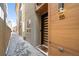 Modern townhome entry with wood siding and sleek door at 4455 Tennyson St, Denver, CO 80212