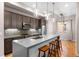 Modern kitchen with stainless steel appliances and an island at 4455 Tennyson St, Denver, CO 80212