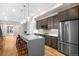 Modern kitchen with stainless steel appliances and an island at 4455 Tennyson St, Denver, CO 80212