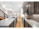 Modern kitchen with stainless steel appliances and an island at 4455 Tennyson St, Denver, CO 80212