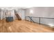 Modern kitchen with dark cabinetry, gray island, and hardwood floors at 4455 Tennyson St, Denver, CO 80212