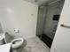 Stylish bathroom featuring a glass-enclosed shower with modern fixtures at 15962 E Exposition Dr, Aurora, CO 80017