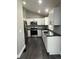 Beautifully updated kitchen featuring stainless steel appliances and sleek countertops at 15962 E Exposition Dr, Aurora, CO 80017