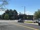 Street view of a well-maintained neighborhood with school and light traffic at 15962 E Exposition Dr, Aurora, CO 80017