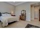 Bright main bedroom with hardwood floors and a walk-in closet at 23636 E Del Norte Pl, Aurora, CO 80016