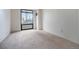 Bright, carpeted bedroom with large window looks out to city landscape at 1625 Larimer St # 605, Denver, CO 80202