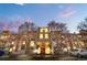 Exterior shot of building with multiple stories and front entrance, landscaping with trees, and multiple balconies at 1300 S Parker Rd # 9, Denver, CO 80231
