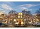 Exterior shot of building with multiple stories and front entrance, landscaping with trees, and multiple balconies at 1300 S Parker Rd # 9, Denver, CO 80231