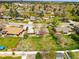 Aerial view of the property showing a spacious backyard, fire pit and neighboring houses at 7751 S Race St, Centennial, CO 80122
