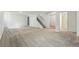 Spacious basement area with neutral carpet, stairs to the upper level, and an adjacent bathroom at 7751 S Race St, Centennial, CO 80122