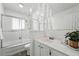 Bright bathroom featuring shower-tub combo and sink with vanity at 7751 S Race St, Centennial, CO 80122