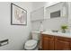 Half bathroom features modern fixtures and a sink with vanity at 7751 S Race St, Centennial, CO 80122