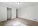 Bedroom with double closet doors and neutral carpeting at 7751 S Race St, Centennial, CO 80122