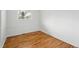 Empty bedroom featuring hardwood floors and natural light at 7751 S Race St, Centennial, CO 80122