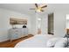Bedroom with grey dresser, closet, and hardwood floors at 7751 S Race St, Centennial, CO 80122