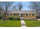 Charming single-story home featuring a well-maintained lawn and mature landscaping at 7751 S Race St, Centennial, CO 80122
