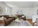 Inviting living room featuring hardwood floors, neutral paint, and ample seating at 7751 S Race St, Centennial, CO 80122