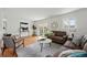Bright living room featuring hardwood floors, neutral paint, and sliding glass doors to the backyard at 7751 S Race St, Centennial, CO 80122