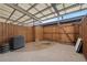 View of the back patio with a wood fence, concrete, and a metal awning over part of the space at 9019 E Oxford Dr, Denver, CO 80237