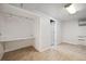 This basement has a built-in desk, tile flooring, and neutral paint, offering space for functionality and personalization at 9019 E Oxford Dr, Denver, CO 80237