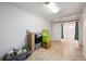 Unfinished basement space offering storage, tiled flooring and access to other areas at 9019 E Oxford Dr, Denver, CO 80237