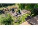 Aerial view of landscaped backyard with garden, seating, and fire pit at 332 Maple Dr, Frederick, CO 80530
