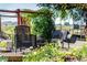 Backyard with outdoor seating near garden with wildflowers and a BBQ grill at 332 Maple Dr, Frederick, CO 80530