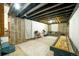 Unfinished basement space with exposed ceiling and framed walls, offering potential for customization at 332 Maple Dr, Frederick, CO 80530