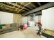 Partially finished basement featuring a living area and laundry area, offering versatile space at 332 Maple Dr, Frederick, CO 80530