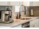 Close up of kitchen featuring modern faucet, white countertops, and stainless steel appliances at 332 Maple Dr, Frederick, CO 80530