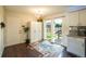 Bright kitchen area with sliding glass doors leading to backyard deck at 332 Maple Dr, Frederick, CO 80530