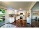 Modern kitchen with white cabinetry, stainless steel appliances, and an eat-in breakfast nook at 332 Maple Dr, Frederick, CO 80530
