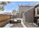 Cozy backyard patio with storage shed and snow covered ground at 1218 S Flower Cir # A, Lakewood, CO 80232