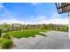 Backyard featuring a patio with geometric pavers, grass, and landscaping at 4755 Memphis St # 2, Denver, CO 80239