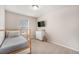 Bedroom featuring wood frame bunk bed, neutral walls, and plush carpet at 4755 Memphis St # 2, Denver, CO 80239