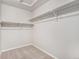 Walk-in closet with neutral walls and carpeted flooring at 4755 Memphis St # 2, Denver, CO 80239