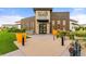 Clubhouse Exterior featuring brick facade, orange planters, and bike rack at 4755 Memphis St # 2, Denver, CO 80239
