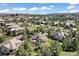 Stunning aerial view of a residential community with lush greenery and well-maintained homes in a picturesque setting at 5055 Mcclure Ln, Castle Rock, CO 80108