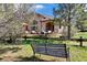 Inviting backyard with stone patio, comfortable seating, and lush landscaping, perfect for outdoor relaxation at 5055 Mcclure Ln, Castle Rock, CO 80108