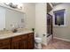 Full bathroom shows granite countertop vanity, dark wood cabinet and walk-in shower with black trim at 5055 Mcclure Ln, Castle Rock, CO 80108