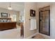 The bathroom features a step-in shower and is connected to the bedroom with a dark wood sleigh bed at 5055 Mcclure Ln, Castle Rock, CO 80108