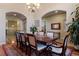Formal dining room with a large table, elegant chairs, and decorative rug at 5055 Mcclure Ln, Castle Rock, CO 80108