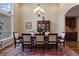 Elegant dining room with hardwood floors, a chandelier, and traditional decor at 5055 Mcclure Ln, Castle Rock, CO 80108