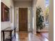 Bright foyer with tile flooring, a wood door with glass panels, and stylish decor at 5055 Mcclure Ln, Castle Rock, CO 80108