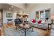 Cozy living room with hardwood floors, comfortable seating, and open floor plan to the kitchen at 5055 Mcclure Ln, Castle Rock, CO 80108