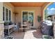 Inviting covered patio features an outdoor table and chairs, and a gas heater at 5055 Mcclure Ln, Castle Rock, CO 80108