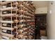 Well-stocked wine cellar with wooden racks at 5055 Mcclure Ln, Castle Rock, CO 80108
